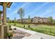 Well-maintained front yard with lush lawn and beautiful landscaping at 1273 S Dallas Ct, Denver, CO 80247