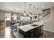 Open-concept kitchen flowing into living and dining areas, perfect for entertaining at 1273 S Dallas Ct, Denver, CO 80247