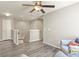 Open living area with hardwood floors, ceiling fan, and natural light at 1273 S Dallas Ct, Denver, CO 80247