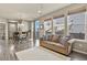 Bright living room with a sofa, dining table set, and beautiful hardwood floors at 1273 S Dallas Ct, Denver, CO 80247