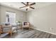 Cozy living room featuring wood-look floors and contemporary furnishings at 1273 S Dallas Ct, Denver, CO 80247