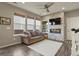 Bright living room with lots of natural light, contemporary decor, and a modern fireplace at 1273 S Dallas Ct, Denver, CO 80247