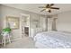 Main bedroom with en-suite bathroom and a white dresser at 1273 S Dallas Ct, Denver, CO 80247