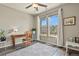 Cozy office with a desk, chair, and large windows offering plenty of natural light at 1273 S Dallas Ct, Denver, CO 80247