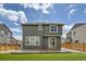 A backyard features a grassy area, concrete patio, and wood fence at 4875 E 148Th Pl, Thornton, CO 80602