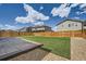 This beautiful backyard features a grassy area and a concrete patio at 4875 E 148Th Pl, Thornton, CO 80602