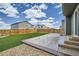 This backyard has a grassy area, gravel area, and concrete patio at 4875 E 148Th Pl, Thornton, CO 80602