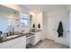 Bathroom with double vanity sinks, black countertops, and a separate shower area at 4875 E 148Th Pl, Thornton, CO 80602