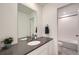 A modern bathroom features a grey countertop and tiled shower at 4875 E 148Th Pl, Thornton, CO 80602