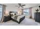 Comfortable main bedroom with a ceiling fan, neutral color palette, and natural light at 4875 E 148Th Pl, Thornton, CO 80602