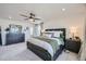 Spacious main bedroom with a ceiling fan, dark wood furniture, and a well-lit ambiance at 4875 E 148Th Pl, Thornton, CO 80602