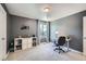 This bright office features grey walls and a storage shelf at 4875 E 148Th Pl, Thornton, CO 80602