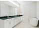 Modern bathroom with double vanity, soaking tub, and sleek fixtures at 10730 Hanging Lake Pl, Parker, CO 80138
