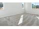 Bright bedroom with a modern gray carpet and natural light from windows at 10730 Hanging Lake Pl, Parker, CO 80138