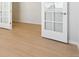 Bright room featuring hardwood flooring and french doors at 10730 Hanging Lake Pl, Parker, CO 80138