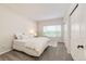 Bright bedroom with neutral carpet, a large window, and ample closet space at 5439 S Dover St # 101, Littleton, CO 80123