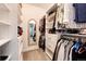 Organized walk-in closet with shelving and hanging space for clothing and accessories at 5439 S Dover St # 101, Littleton, CO 80123