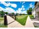 Scenic community grounds with a bridge, pathway, and well-maintained landscaping at 5439 S Dover St # 101, Littleton, CO 80123