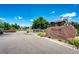 Community entrance features a large stone sign with 'Willow Ranch' and gated entry on a bright, sunny day at 5439 S Dover St # 101, Littleton, CO 80123