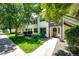 Exterior view of home showing landscaped grounds, a well-maintained lawn and welcoming entryway on a bright day at 5439 S Dover St # 101, Littleton, CO 80123