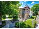 Exterior of a two-story home showing landscaped grounds, neutral colors, and inviting stair access on a clear day at 5439 S Dover St # 101, Littleton, CO 80123
