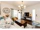 Bright living room showcasing dark hardwood floors, eclectic decor, and access to a sunny balcony at 5439 S Dover St # 101, Littleton, CO 80123