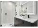 Spa-like bathroom features double sinks, modern fixtures, and a luxurious shower at 1250 Yates St, Denver, CO 80204