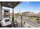Relaxing outdoor balcony with comfortable seating and views of the vibrant neighborhood and street at 1735 Lowell Blvd, Denver, CO 80204