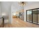 Modern kitchen with stainless steel appliances, hardwood floors, and sliding doors creating a bright and open cooking space at 1735 Lowell Blvd, Denver, CO 80204