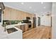 Modern kitchen with light wood cabinets, stainless steel appliances, and a white quartz countertop at 1735 Lowell Blvd, Denver, CO 80204