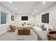 This staged living room features a comfortable seating arrangement and plenty of natural light at 1735 Lowell Blvd, Denver, CO 80204