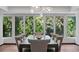 Large dining room with decorative chandelier, and a view into the backyard at 4766 S Fillmore Ct, Cherry Hills Village, CO 80113