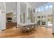 Bright dining room with hardwood floors, stone accents, and modern furnishings at 4766 S Fillmore Ct, Cherry Hills Village, CO 80113