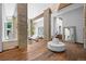 Spacious foyer features hardwood floors, stone accents, modern furnishings and lots of light at 4766 S Fillmore Ct, Cherry Hills Village, CO 80113