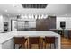 Modern kitchen with stainless appliances, wine fridge and oversized island with seating at 4766 S Fillmore Ct, Cherry Hills Village, CO 80113