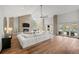 Spacious living room with fireplace, open floorplan, and access to outdoor pool area at 4766 S Fillmore Ct, Cherry Hills Village, CO 80113