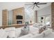 Comfortable living room featuring a stone fireplace, and open floor plan at 4766 S Fillmore Ct, Cherry Hills Village, CO 80113