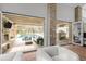 Inviting living room seamlessly connects with an outdoor kitchen and pool area at 4766 S Fillmore Ct, Cherry Hills Village, CO 80113