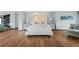 Serene main bedroom with a plush bed, stylish nightstands, and hardwood flooring at 4766 S Fillmore Ct, Cherry Hills Village, CO 80113
