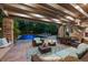 Inviting outdoor patio with comfortable seating, a dining area, and a view of the sparkling pool, perfect for entertaining at 4766 S Fillmore Ct, Cherry Hills Village, CO 80113