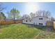 Large backyard featuring a green lawn and a sturdy wood fence at 1524 Twin Sisters Dr, Longmont, CO 80504