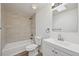 Well-lit bathroom with a shower-tub combo, vanity, and a neutral color scheme at 1524 Twin Sisters Dr, Longmont, CO 80504