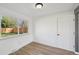 Sunlit bedroom features new flooring, fresh paint, a new window, and a closet at 1524 Twin Sisters Dr, Longmont, CO 80504