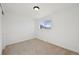 Cozy bedroom featuring neutral carpet, white walls, and a bright window at 1524 Twin Sisters Dr, Longmont, CO 80504