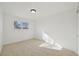 Cozy bedroom features a window letting in natural light and neutral carpet for comfort at 1524 Twin Sisters Dr, Longmont, CO 80504