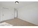 Bright bedroom features neutral carpet and a spacious closet for ample storage at 1524 Twin Sisters Dr, Longmont, CO 80504