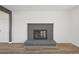 Modern living room showcasing brick fireplace and hardwood flooring at 1524 Twin Sisters Dr, Longmont, CO 80504