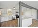 Open kitchen boasts stone counters, white cabinets, stainless appliances, and a center island at 1524 Twin Sisters Dr, Longmont, CO 80504