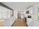 Modern kitchen featuring white cabinets, stainless steel appliances, and a spacious center island at 1524 Twin Sisters Dr, Longmont, CO 80504