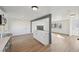 Bright living room with hardwood floors, white walls, and a view to the living room at 1524 Twin Sisters Dr, Longmont, CO 80504